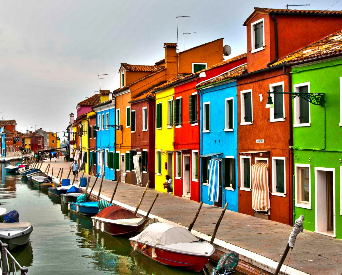 brightly painted homes on water